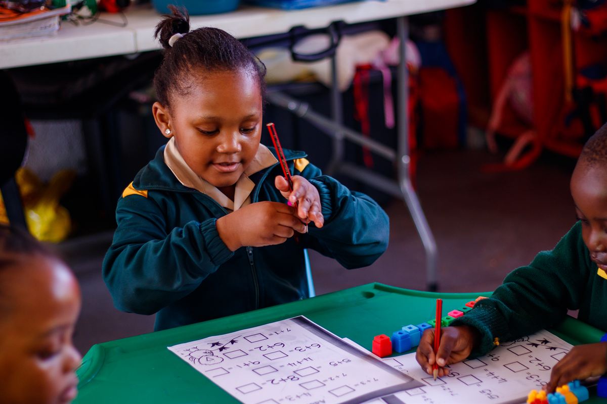 A Vantage Point learner working through addition exercises in class